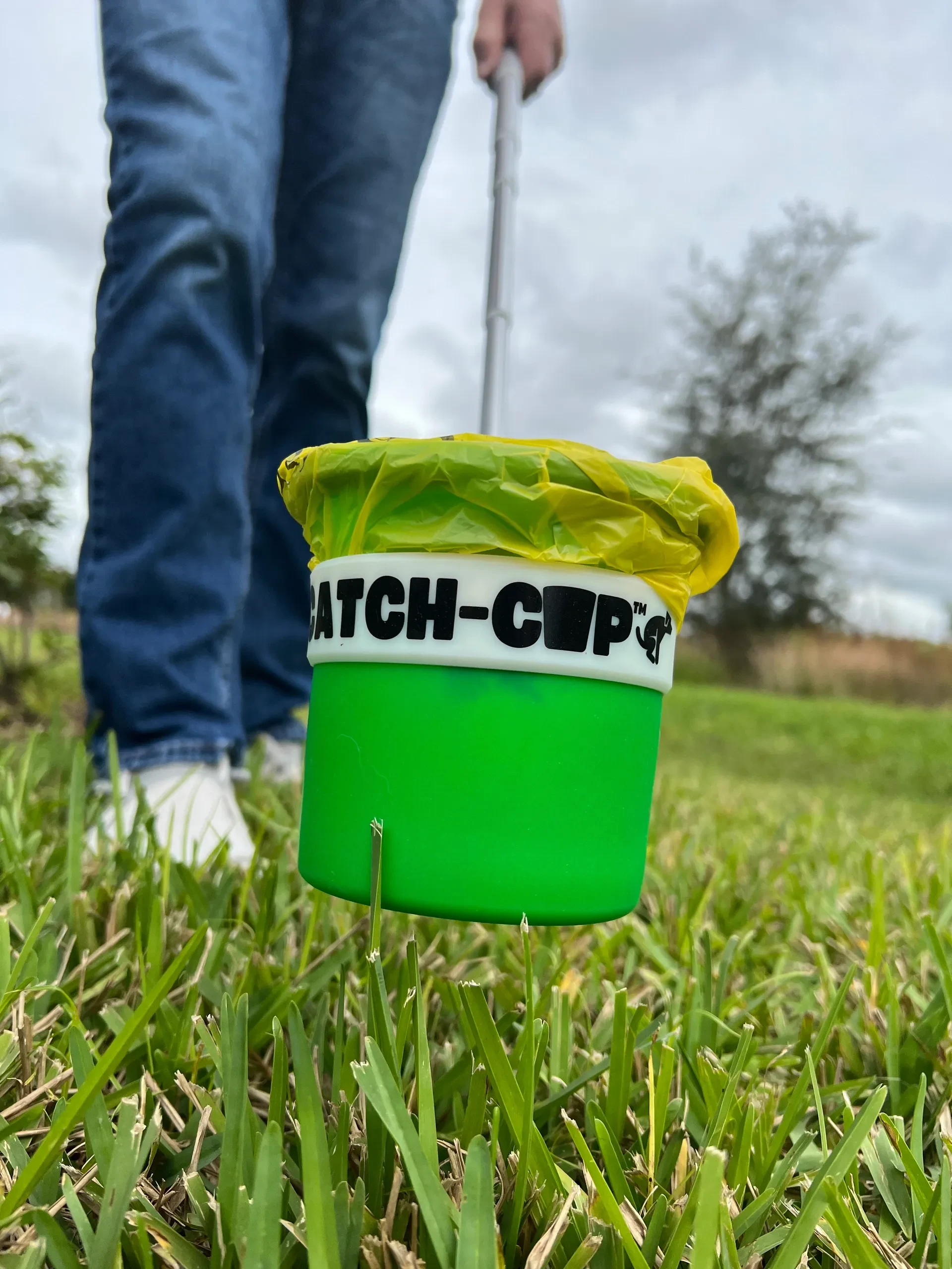 CatchCap cup close up with bag liner on grass